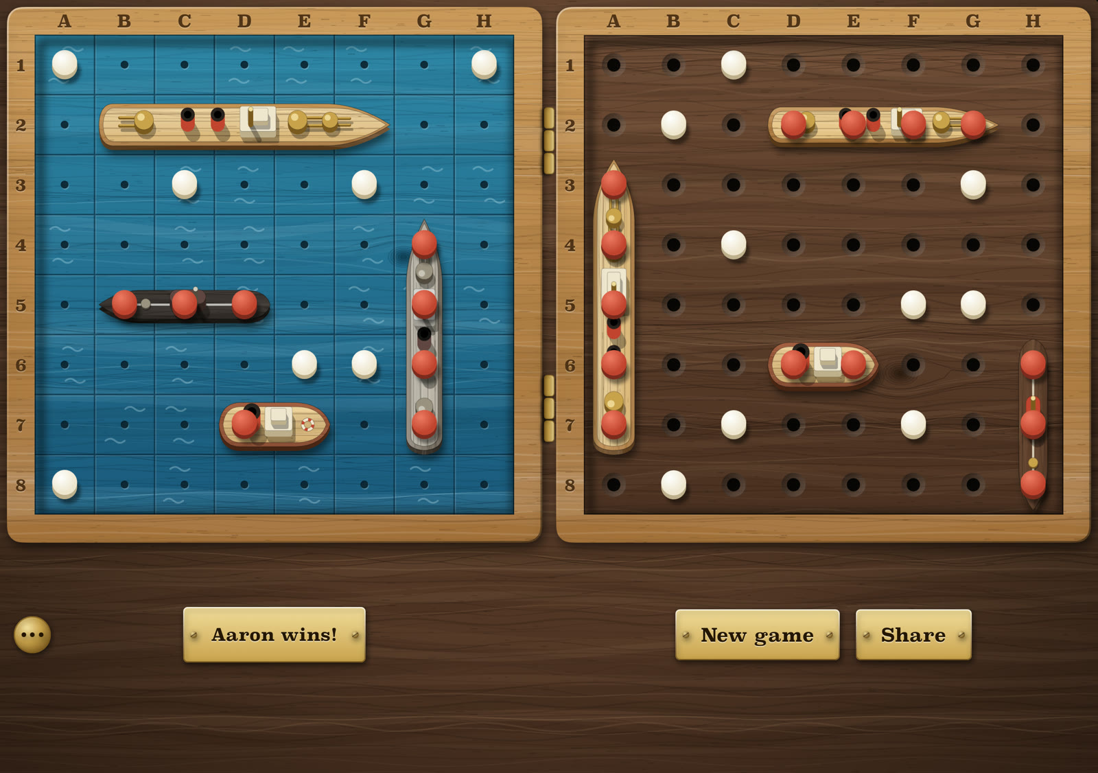 A finished game on the inner display: the other fleet's four ships laid on the shots board with red pegs along them.